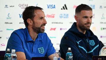 England's coach Gareth Southgate (L) and England's midfielder Jordan Henderson give a press conference at the Qatar National Convention Center (QNCC) in Doha on November 28, 2022, on the eve of the Qatar 2022 World Cup football match between Wales and England. (Photo by Paul ELLIS / AFP)