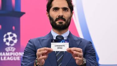 Champions League's ambassador Turkish former footballer Hamit Altintop shows the paper slip of Liverpool FC during the draw for the round of 16 of the 2022-2023 UEFA Champions League football tournament in Nyon on October 7, 2022. (Photo by Fabrice COFFRINI / AFP) (Photo by FABRICE COFFRINI/AFP via Getty Images)