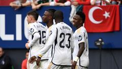 Real Madrid's Brazilian forward #07 Vinicius Junior (R) celebrates scoring his team's fourth goal during the Spanish league football match between CA Osasuna and Real Madrid CF at El Sadar stadium in Pamplona on March 16, 2024. (Photo by ANDER GILLENEA / AFP)