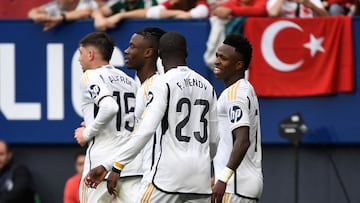 Real Madrid's Brazilian forward #07 Vinicius Junior (R) celebrates scoring his team's fourth goal during the Spanish league football match between CA Osasuna and Real Madrid CF at El Sadar stadium in Pamplona on March 16, 2024. (Photo by ANDER GILLENEA / AFP)