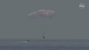 A capsule with NASA astronauts Robert Behnken and Douglas Hurley splashes down in the Gulf of Mexico, August 2, 2020, in this screen grab taken from a video. NASA/Handout via REUTERS   ATTENTION EDITORS - THIS IMAGE HAS BEEN SUPPLIED BY A THIRD PARTY.