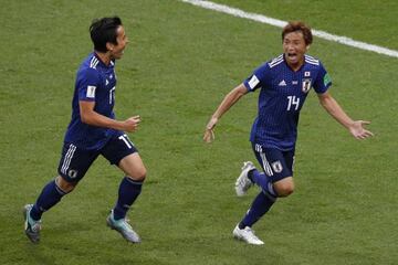 Takashi Inui (right) celebrates with Makoto Hasebe after scoring against Belgium.