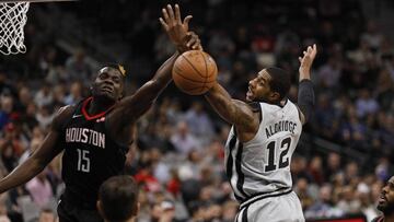 Nov 30, 2018; San Antonio, TX, USA; San Antonio Spurs power forward LaMarcus Aldridge (12) and Houston Rockets center Clint Capela (15) battle for a rebound during the first half at AT&T Center. Mandatory Credit: Soobum Im-USA TODAY Sports