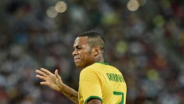 (FILES) In this file photo taken on October 14, 2014 Brazil's forward Robinho reacts after he misses a goal in a friendly football match against Japan at the National stadium in Singapore. - A judge prohibited on March 24, 2023 former football player Robinho from leaving Brazil in the middle of a process that local justice is carrying out, at the request of Italy, to standardize the sentence of nine years in prison to which he was sentenced for gang rape of a young woman in Milan in 2013. (Photo by Roslan RAHMAN / AFP)