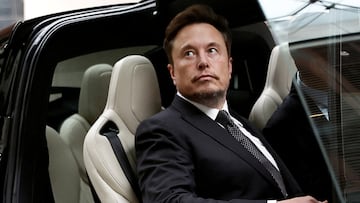 FILE PHOTO: Tesla Chief Executive Officer Elon Musk gets in a Tesla car as he leaves a hotel in Beijing, China May 31, 2023. REUTERS/Tingshu Wang/File Photo