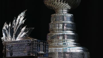 DENVER, COLORADO - JUNE 14: The Conn Smythe Trophy and the Stanley Cup are on display during the 2022 NHL Stanley Cup Final Media Day