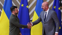 Ukrainian President Volodymyr Zelenskiy shakes hands with European Council President Charles Michel, on the first day of the European Union leaders' summit in Brussels, Belgium, June 27, 2024. REUTERS/Johanna Geron