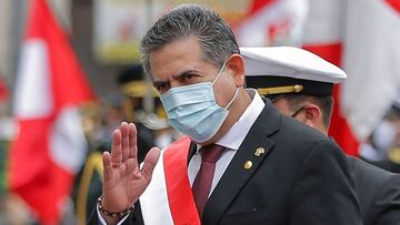 (FILES) In this file picture taken on November 10, 2020 the head of the Peruvian Congress, Manuel Merino, waves after being sworn in as interim President in Lima, day after the Congress voted to impeach and oust President Martin Vizcarra over corruption allegations. - Peru&#039;s President Manuel Merino resigned on Novemer 15, 2020, just five days after taking office, sparking wild street celebrations in the capital Lima after protests against his rule. (Photo by Luka GONZALES / AFP)