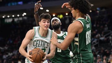 Boston Celtics forward Hugo Gonzalez (28) looks for a shot against Milwaukee Bucks center Jericho Sims (00) and forward Bobby Portis (9) in the fourth quarter at Fiserv Forum.