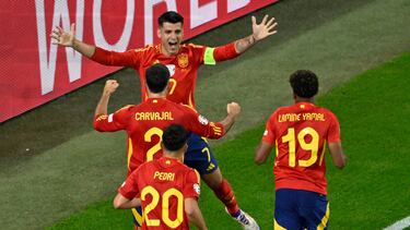 Spain's forward #07 Alvaro Morata celebrates with teammates after an own goal giving Spain the lead during the UEFA Euro 2024 Group B football match between Spain and Italy at the Arena AufSchalke in Gelsenkirchen on June 20, 2024. (Photo by INA FASSBENDER / AFP)