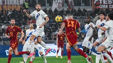 Roma's Italian defender #23 Gianluca Mancini (C-R) heads the ball to score an equalizer despite Inter Milan's Italian defender #15 Francesco Acerbi (Front L) during the Italian Serie A football match between AS Roma and Inter Milan at the Olympic stadium in Rome on February 10, 2024. (Photo by Alberto PIZZOLI / AFP)