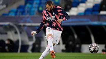 Real Madrid's French forward Karim Benzema warms up before the UEFA Champions League semi-final first leg football match between Real Madrid and Chelsea at the Alfredo di Stefano stadium in Valdebebas, on the outskirts of Madrid, on April 27, 2021. (