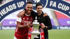 FILE PHOTO: Soccer Football - FA Cup Final - Arsenal v Chelsea - Wembley Stadium, London, Britain - August 1, 2020 Arsenal manager Mikel Arteta and Pierre-Emerick Aubameyang celebrate with the trophy after winning the FA Cup, as play resumes behind closed
