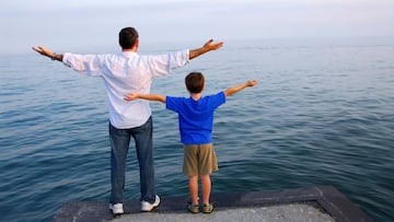 Father and son on a pier relaxing together