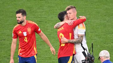 Spain's defender #02 Dani Carvajal cheers Germany's midfielder #08 Toni Kroos at the end of the UEFA Euro 2024 quarter-final football match between Spain and Germany at the Stuttgart Arena in Stuttgart on July 5, 2024. (Photo by Kirill KUDRYAVTSEV / AFP)