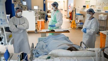 AIRDRIE, SCOTLAND - FEBRUARY 05: Staff at University Hospital Monklands attend to a Covid-positive patient on the ICU ward on February 5, 2021 in Airdrie, Scotland. The numbers of patients with Coronavirus at Lanarkshire hospitals hit record levels during