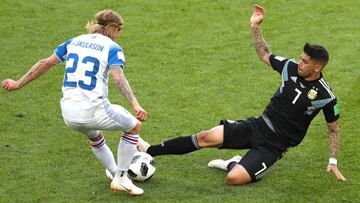 MOSCOW, RUSSIA - JUNE 16: Ever Banega of Argentina tackles Ari Skulason of Iceland during the 2018 FIFA World Cup Russia group D match between Argentina and Iceland at Spartak Stadium on June 16, 2018 in Moscow, Russia. (Photo by Clive Rose/Getty Image