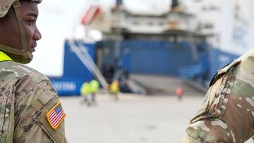 U.S. service members work as Vehicles Carrier vessel ARC Endurance arrives with U.S. Army AH-64 Apache helicopters at Esbjerg Harbor, Denmark August 22, 2022. Ritzau Scanpix/Claus Fisker via REUTERS THIS IMAGE WAS PROVIDED BY A THIRD PARTY. DENMARK OUT.