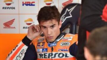 Repsol Honda Team rider Marc Marquez of Spain takes a rest after a free practice session at the MotoGP Japanese Grand Prix in Motegi, Tochigi prefecture on October 9, 2015. AFP PHOTO / KAZUHIRO NOGI