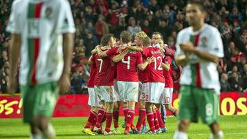 Danish players celebrate after defeating Portugal in their Euro 2012 Group H qualifying soccer match in Copenhagen October 11, 2011. REUTERS/Keld Navntoft/Scanpix (DENMARK - Tags: SPORT SOCCER) THIS IMAGE HAS BEEN SUPPLIED BY A THIRD PARTY. IT IS DISTRIBU