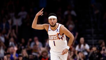 PHOENIX, ARIZONA - OCTOBER 16: Devin Booker #1 of the Phoenix Suns reacts after a three-point basket during the first half against the Portland Trail Blazers at Footprint Center on October 16, 2023 in Phoenix, Arizona. NOTE TO USER: User expressly acknowledges and agrees that, by downloading and or using this photograph, User is consenting to the terms and conditions of the Getty Images License Agreement.   Chris Coduto/Getty Images/AFP (Photo by Chris Coduto / GETTY IMAGES NORTH AMERICA / Getty Images via AFP)