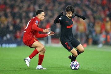 Joao Félix of Atletico Madrid is challenged by Trent Alexander-Arnold of Liverpool.