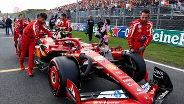 Ferrari's Spanish driver Carlos Sainz sits in his car on the grid ahead of the Formula One Dutch Grand Prix at The Circuit Zandvoort, western Netherlands, on August 25, 2024. (Photo by SIMON WOHLFAHRT / AFP)