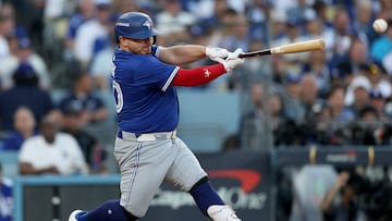 LOS ANGELES, CALIFORNIA - OCTOBER 27: Alejandro Kirk #30 of the Toronto Blue Jays hits a single during the second inning against the Los Angeles Dodgers in game three of the 2025 World Series at Dodger Stadium on October 27, 2025 in Los Angeles, California.   Patrick Smith/Getty Images/AFP (Photo by Patrick Smith / GETTY IMAGES NORTH AMERICA / Getty Images via AFP)