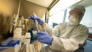 Giovanni Cattoli, head of the joint FAO/IAEA Animal Production and Health Laboratory, shows test kits sent to IAEA member countries that enable them to run real time RT-PCR tests to detect whether a person has been infected with COVID-19, at the IAEA's Laboratories in Seibersdorf, Austria, on May 7, 2020. - Shortages of materials needed in tests for the novel coronavirus continue to be "critical", according to the head of a UN lab, which is supplying countries with COVID-19 detection tests. (Photo by JOE KLAMAR / AFP)