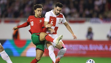 Portugal's forward #10 Joao Felix (L) and Croatia's defender #06 Josip Sutalo (R) fight for the ball during the UEFA Nations League, League A - Group A1 football match between Croatia and Portugal at the Poljud Stadium in Split, on November 18, 2024. (Photo by Damir SENCAR / AFP)