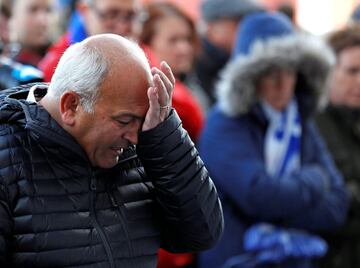 Leicester City football fans pay their respects outside the football stadium, after the helicopter of the club owner Thai businessman Vichai Srivaddhanaprabha crashed when leaving the ground on Saturday evening after the match, in Leicester, Britain, Octo