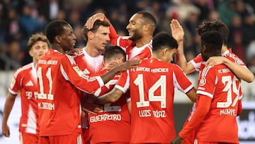 Bayern Munich players celebrate after the German first division Bundesliga football match between FC St Pauli and FC Bayern Munich in Hamburg, northern Germany, on April 11, 2026. (Photo by Ibo OT / AFP) / DFL REGULATIONS PROHIBIT ANY USE OF PHOTOGRAPHS AS IMAGE SEQUENCES AND/OR QUASI-VIDEO