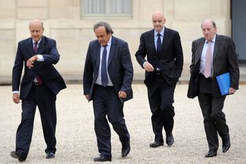 Former French Prime Minister and current mayor of Bordeaux Alain Juppe (L) and UEFA President Michel Platini (C), followed by UEFA General Secretary Gianni Infantino and EURO 2016 President Jacques Lambert (R).