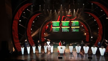 Former Football starts invited to draw the balls are seen on stage during the draw ceremony for the 2022 African Cup of Nations (CAN) in Yaounde, Cameroon, on August 17, 2021. (Photo by Daniel Beloumou Olomo / AFP)