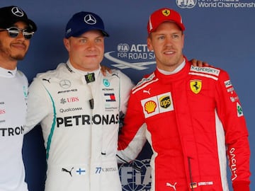 Formula One F1 - Russian Grand Prix - Sochi, Russia - September 29, 2018  Mercedes&#039; Valtteri Bottas (C) after qualifying in pole position with teammate Lewis Hamilton (L), who qualified second and Ferrari&#039;s Sebastian Vettel, who qualified third   REUTERS/Maxim Shemetov