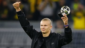 Borussia Dortmund's Erling Braut Haaland acknowledges the fans after receiving an award.
