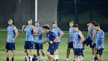 DOHA, QATAR - NOVEMBER 18: A group of workers working in the construction of stadiums that will host the FIFA World Cup Qatar with Argentina national team players take part in a training, in Doha, Qatar on November 18, 2022. (Photo by Mohammed Dabbous/Anadolu Agency via Getty Images)