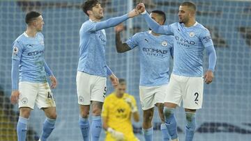 Manchester City&#039;s John Stones, 2nd left, celebrates after scoring his side&#039;s third goal during an English Premier League soccer match between Manchester City and Crystal Palace at the Etihad Stadium in Manchester, England, Sunday Jan.17, 2021. (