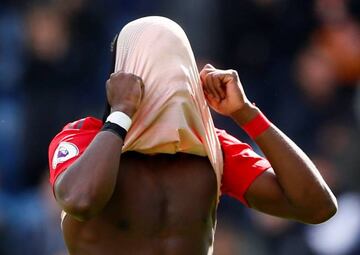 Manchester United's Paul Pogba looks dejected after draw with Huddersfield that ruled out Champions League qualification spot.