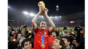 Andres Iniesta holds the World Cup trophy after the 2010 World Cup final 