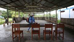 A worker disinfects the area before its being set up as a vaccination centre to administer the Pfizer-BioNTech vaccine against the coronavirus disease (COVID-19), in the Santa Maria de Ojial community, in Iquitos, Peru May 15, 2021. Picture taken May 15, 2021.  REUTERS/Liz Tasa  NO RESALES. NO ARCHIVES