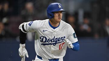 Los Angeles Dodgers' Shohei Ohtani runs to first base during the first inning of the 2024 MLB Seoul Series baseball game 2 between Los Angeles Dodgers and San Diego Padres at the Gocheok Sky Dome in Seoul on March 21, 2024. (Photo by Jung Yeon-je / AFP)