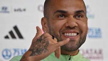 (FILES) In this file photo taken on December 1, 2022 Brazil's defender Dani Alves gives a press conference at the Qatar National Convention Center (QNCC) in Doha. - Former Barcelona defender Dani Alves will remain in preventative custody pending his trial for alleged rape as he is considered a high flight risk, the Provincial Court of Barcelona decided today. (Photo by NELSON ALMEIDA / AFP)