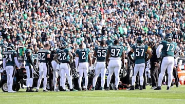 PHILADELPHIA, PENNSYLVANIA - JANUARY 01: Teammates stand around Josh Sweat #94 of the Philadelphia Eagles after an injury against the New Orleans Saints during the first quarter at Lincoln Financial Field on January 01, 2023 in Philadelphia, Pennsylvania.   Dustin Satloff/Getty Images/AFP (Photo by Dustin Satloff / GETTY IMAGES NORTH AMERICA / Getty Images via AFP)