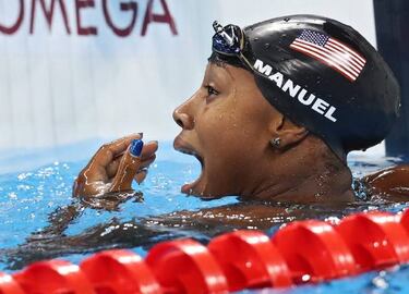 Phelps augments legend status; Simone Manuel makes history