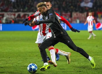 Neymar dribbles past Marko Marin of Red Star Belgrade.