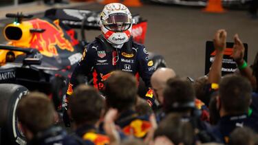 Red Bull's Dutch driver Max Verstappen is greeted by his team after winning the Abu Dhabi Formula One Grand Prix at the Yas Marina Circuit in the Emirati city of Abu Dhabi on December 13, 2020. (Photo by HAMAD I MOHAMMED / POOL / AFP)