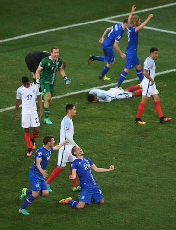 Gylfi Sigurdsson of Iceland falls to his knees in celebration as his team knock out England in the UEFA Euro 2016