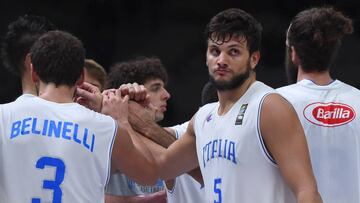 Italy's small forward Alessandro Gentile reacts after Lithuania defeated Italy in their round of 8 basketball match at the EuroBasket 2015 in Lille, northern France, on September 16, 2015. AFP PHOTO / EMMANUEL DUNAND