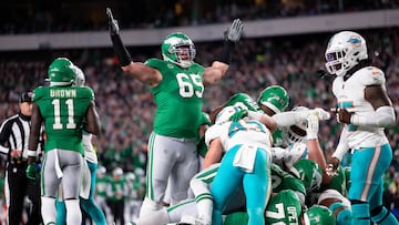 Oct 22, 2023; Philadelphia, Pennsylvania, USA; Philadelphia Eagles offensive tackle Lane Johnson (65) reacts after a Jalen Hurts (1) touchdown on a quarterback sneak against the Miami Dolphins during the second quarter at Lincoln Financial Field. Mandatory Credit: Bill Streicher-USA TODAY Sports